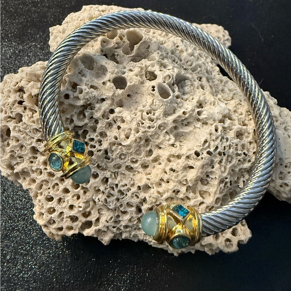 Absolutely beautiful stainless bangle with multi tones and blue stones. 3” wide